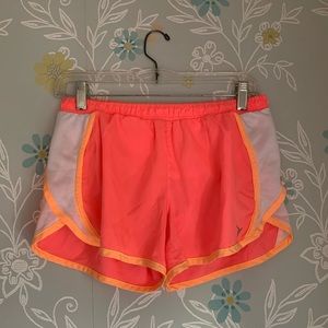 Pink workout shorts.